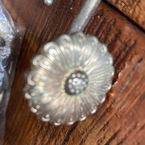 Bag of shower, curtain hangers for your shower curtain in the brass color flower